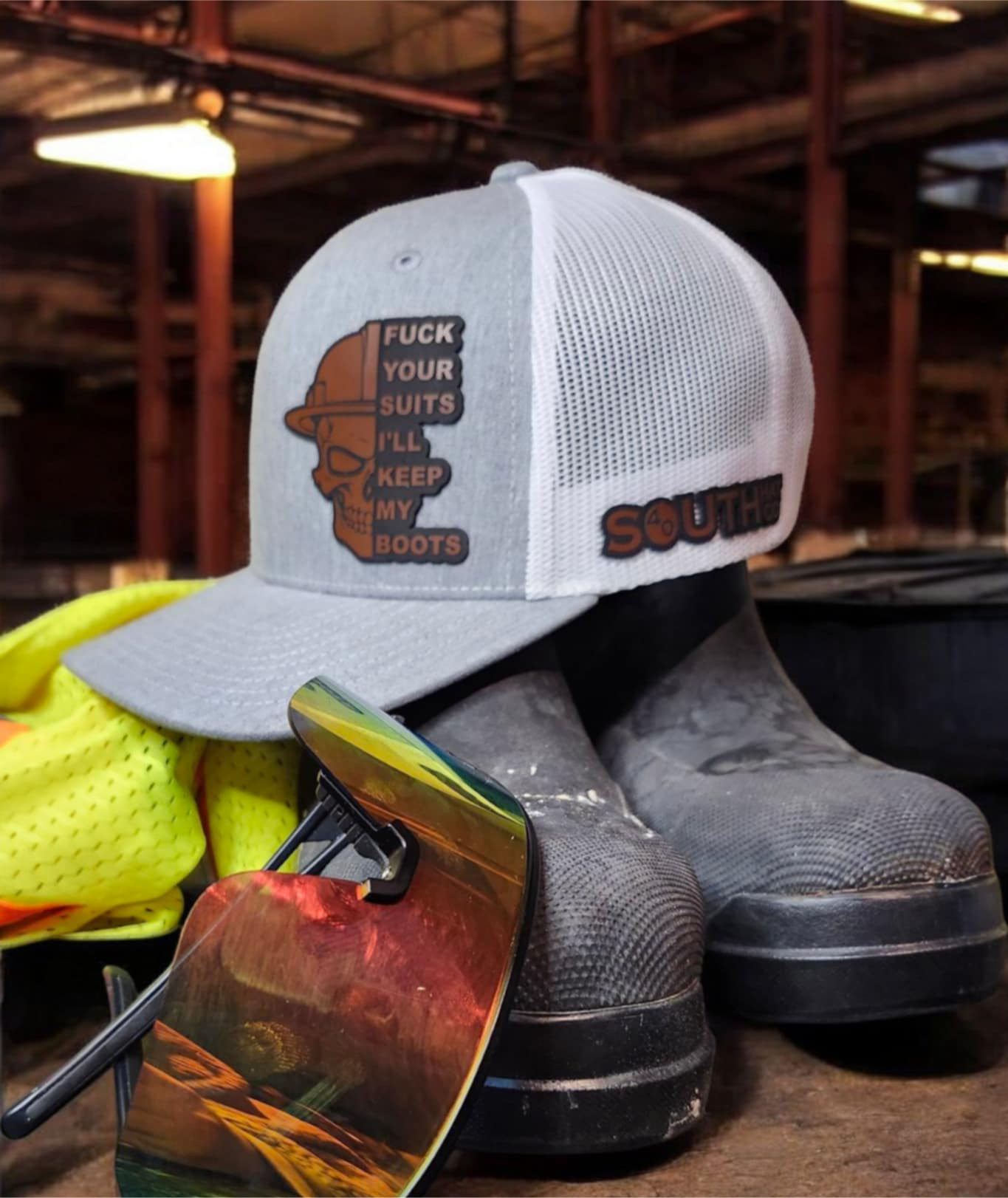 Gray and White Boots Over Suits Trucker Hat