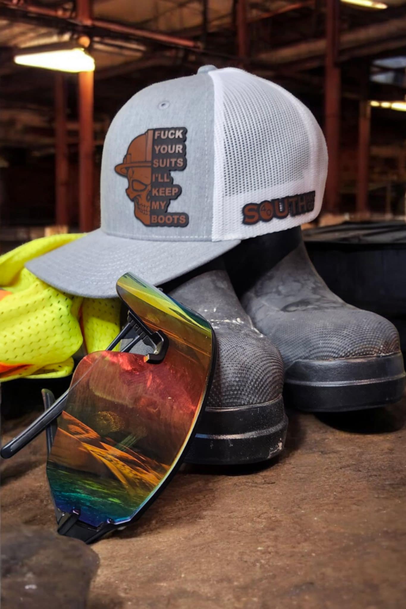 Gray and White Boots Over Suits Trucker Hat